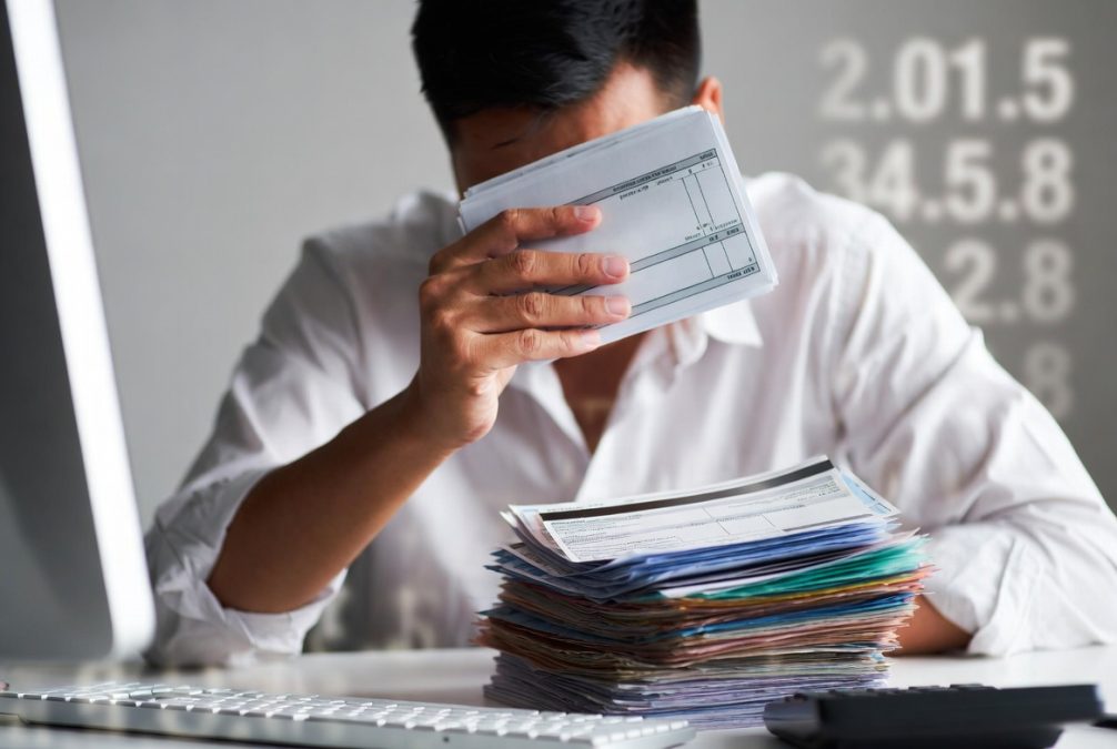 person using debit card for daily expenses and budget control