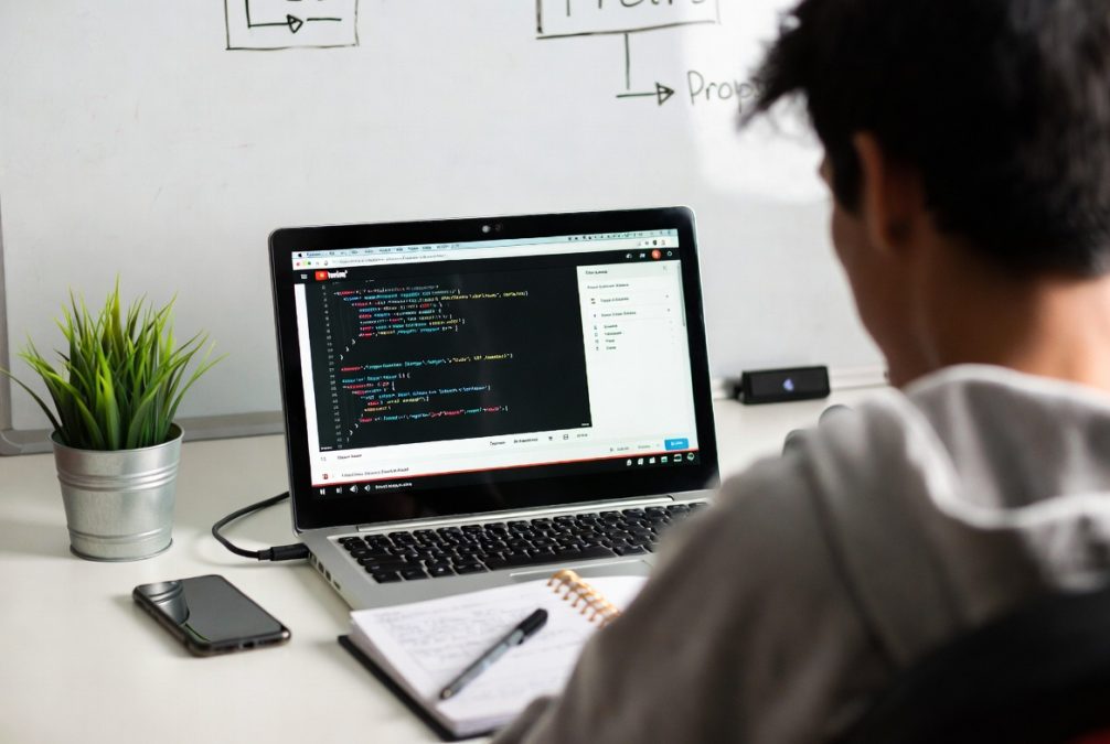 Person learning freelancing skills through online courses and practice